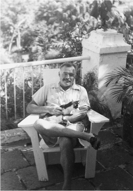 Ernest Hemmingway with his cat.