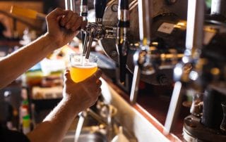 A photo of someone pouring a beer in a Key West Brewery.