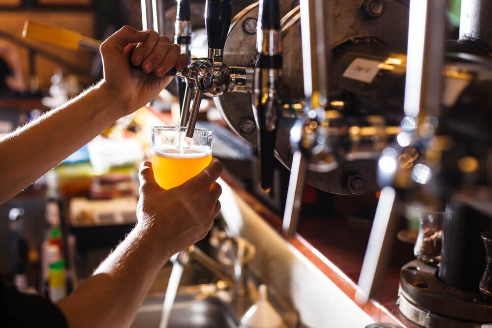A photo of someone pouring a beer in a Key West Brewery.